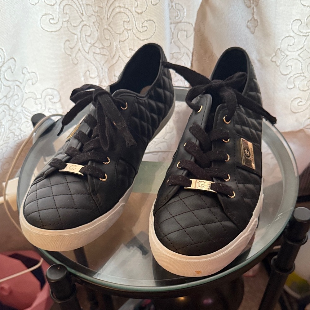 Elegant Black Quilted Sneakers with Gold Accents